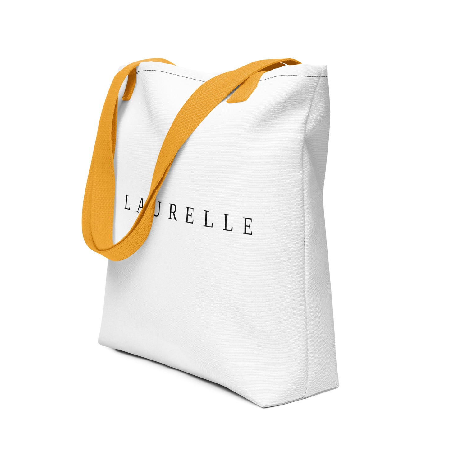 Minimalist canvas tote bag from Laurelle in beige, styled for elegance